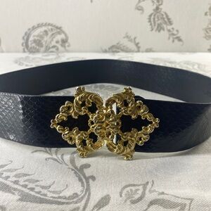 Vintage Gold Toned Ornament
Buckle And Black Belt Sm/Medium